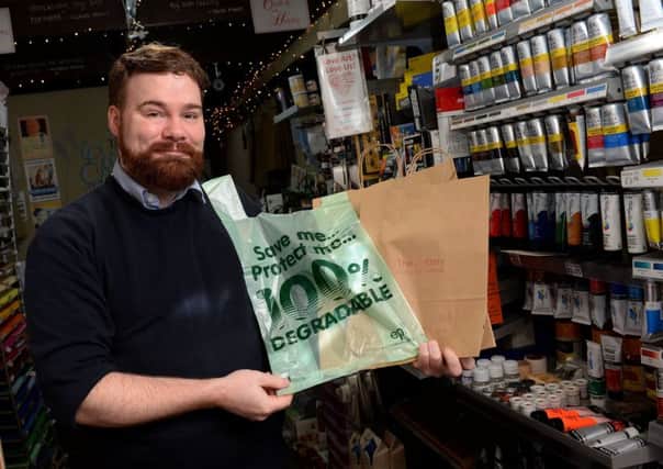 Barry Whitehouse of The Artery, Banbury. Paper and degradable bags are now being used instead of plastic bags. NNL-180123-123817009