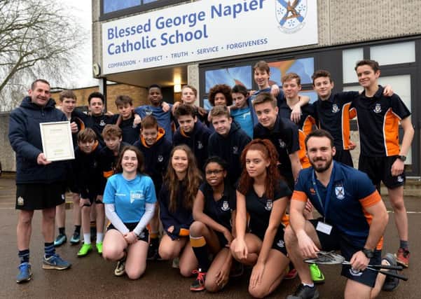 Blessed George Napier School, Banbury, PE award. Stewart Orton, Head of PE, left and Will Woodham, PE teacher, right, with year 10 and year 8 pupils. NNL-180123-121109009