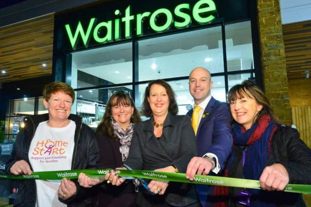 Victoria Prentis MP (centre) cuts the ribbon to officially open the new Waitrose in Banbury with manager Daniel Morehead and representatives from Home-Start, Banbury Young Homelessness Project and The Hill youth and community centre. Photo: Waitrose