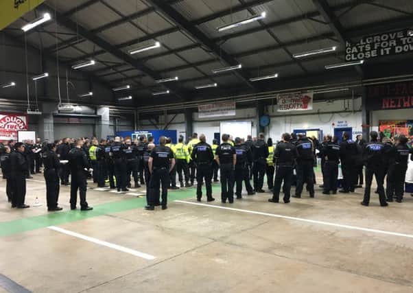 Officers from Operation Nautical being briefed ahead of raids on properties in Banbury and Birmingham in March last year NNL-170328-130408001