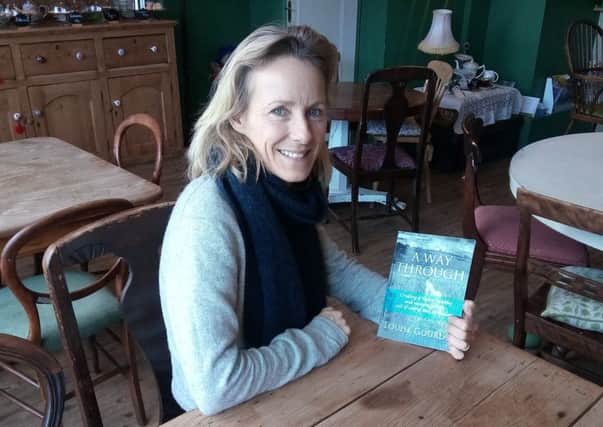 Louise Gourlay with her book, A Way Through, which looks at the holistic approach to health encompassing mind, body and spirit NNL-180202-144517001