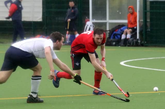 Banbury's Steve O'Connor takes on Trojans' Harry Warren during Saturday's defeat