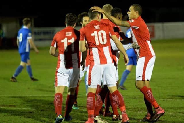 Brackley Town's Glenn Walker congratulates Aaron Williams after his opener against North Ferriby United