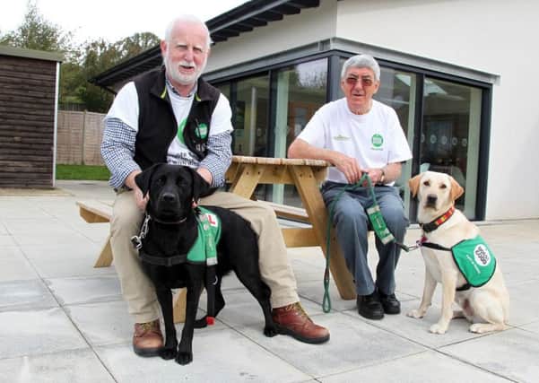 Dogs for Good supporters group autumn craft fair for Dogtober at Frances Hay Centre, Blacklocks Hill. Pictured, Ken MacIver with Connie and David Keable with Charlie NNL-170810-183953009