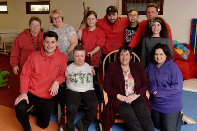 Let's Play Project, Twyford, Adderbury, has a new home. Deb Kerrison, Project Manager, seated, second from right, with young people and play workers. NNL-180220-185334009