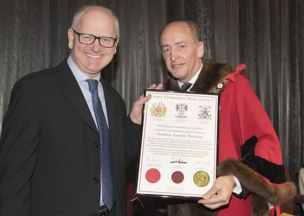 Andrew Maclean receiving his Master Craftman's Certificate from the Rt Hon the Lord Mayor Alderman Charles Bowman. NNL-180228-153701001