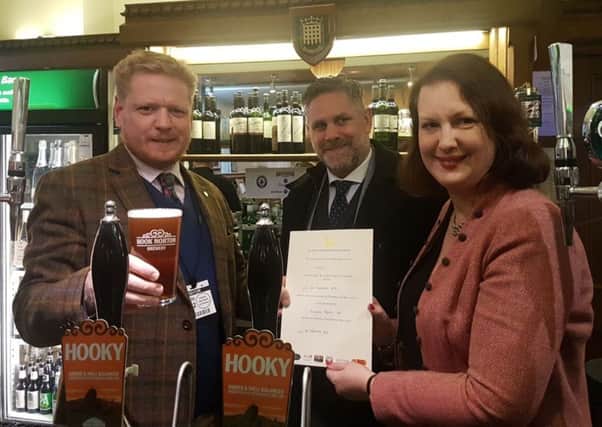 James Clarke (left) and Mark Graham from Hook Norton Brewery in the bar in Parliament with North Oxfordshire MP Victoria Prentis NNL-180203-155845001