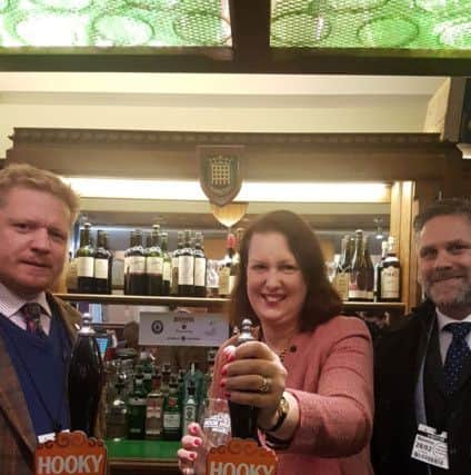 North Oxfordshire MP Victoria Prentis pulls a pint of Hooky in the Commons bar NNL-180203-155856001