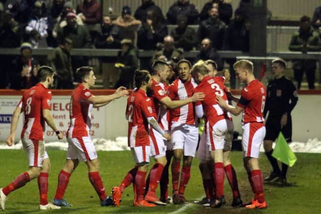 Brackley Town players celebrate following Shane Byrne's winner against Stockport County in Tuesday's replay
