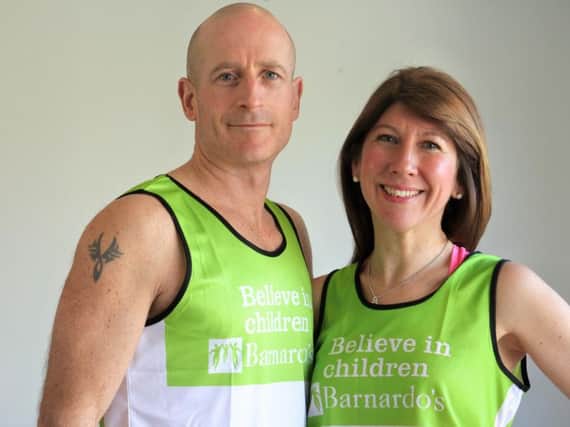 Simon and Rachel Piper in their Barnado's vests they will wear during the London Marathon