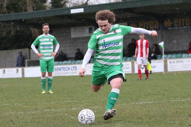 Wantage Town's Ryan Markham scores from the penalty spot against Brackley Town Saints. Photo: sportsshots.org.uk