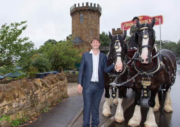 Mark Higgs with the famous Shires at  The Castle at Edgehill. Photo: Hook Norton Brewery