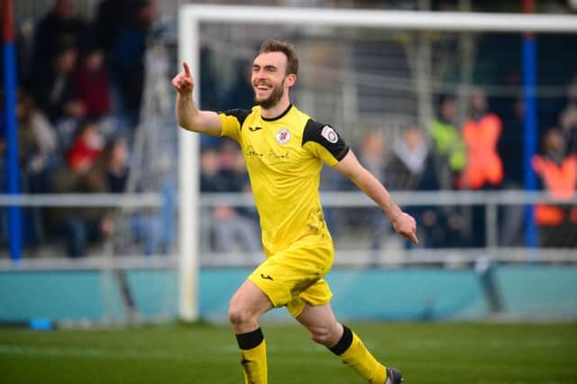 Brackley Town's Shane Byrne celebrates after giving his side the lead at Wealdstone. Photo: Mike Capps