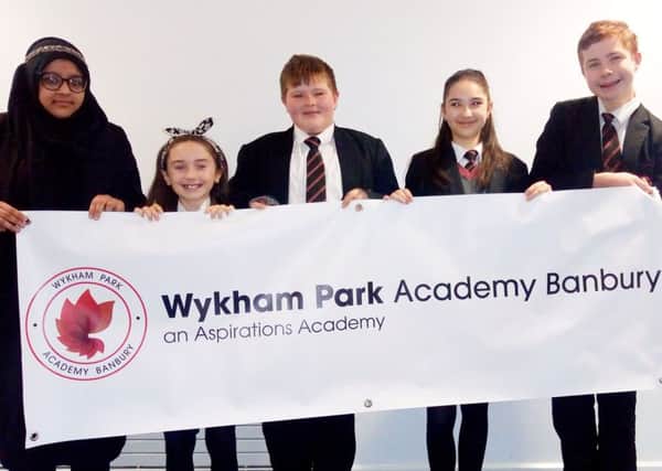Members of the student council proudly display the new name and logo for the former Banbury Academy school NNL-180328-102630001