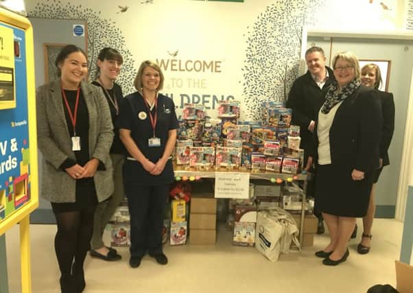Recruitment company Cordant and chocolatier Barry Callebaut donated 200 Easter eggs to the children's ward at Horton Hospital. Left to right: Ceri Harlin from Barry Callebaut, Jen Nichols and Zoe Butler from the Children's Ward, Tom Stops from Barry Callebaut, Tracey Porter and Louise Cooper from Cordant People. NNL-180329-162253001