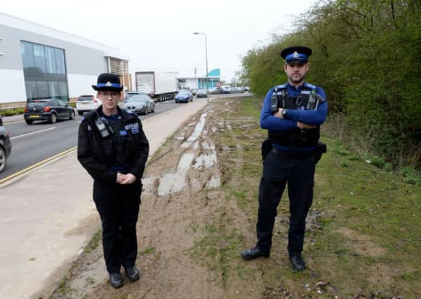 Banbury Gateway Retail Park parking. PCSO Lauren Bushby and PCSO Adam Whiting on patrol near the muddy verge where cars hve been parking. NNL-181004-161828009