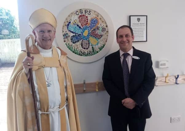 Bishop Collins and head teacher Phil Goldsworthy unveil the plaque in the new building NNL-180423-103826001