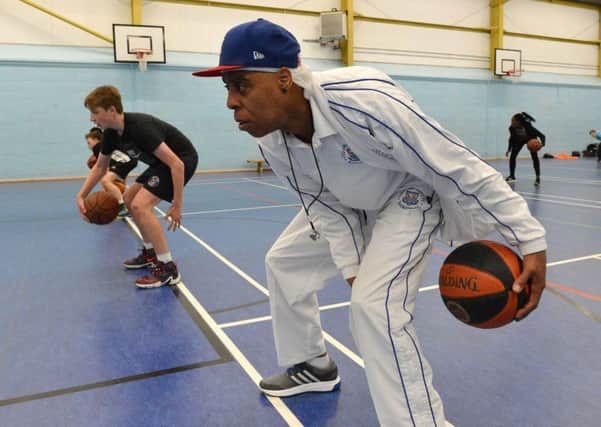Basketball coach, Richard Moses, putting youngsters through their paces at North Oxford Academy. NNL-160714-171120001
