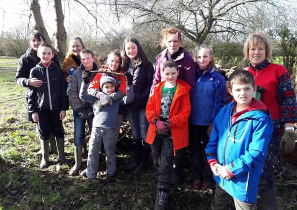 Poppy planting in Brackley for the Ribbon of Poppies project. 5th Brackley cubs. NNL-180805-093429001