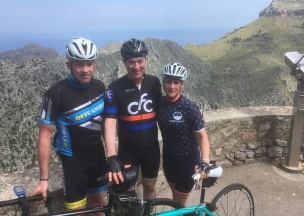 Chris Tunstall, centre, in Mallorca during a cycle ride with brother-in-law Paul Waite, and sister, Mandy Waite. NNL-180905-092714001