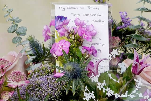 Floral tributes left at Grass Yard at Knightcote in Warwickshire where former pilot Andrew McIntosh killed his estranged wife Patricia. Photo courtesy of  SWNS.com