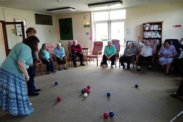 East Close Community Centre. Residents play Boccia, one of many activities in the common room