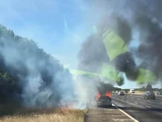 A car caught fire on the M40 near junction 10. Photo: Oxfordshire Fire and Rescue Service
