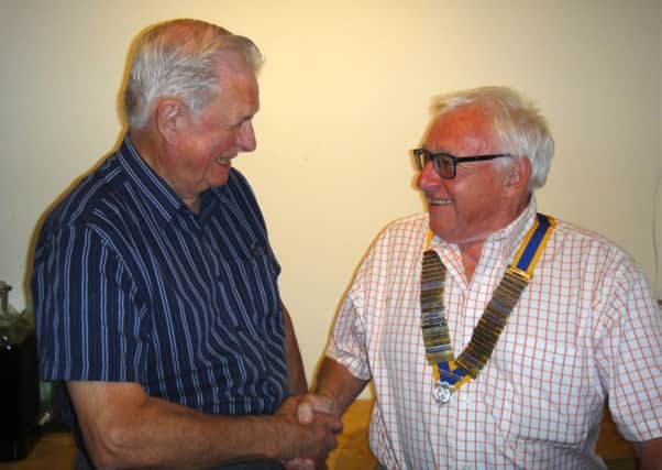 Outgoing Brackley Rotary Club president Ken Smith, handing over to new president Colin Gillies. NNL-180307-094933001