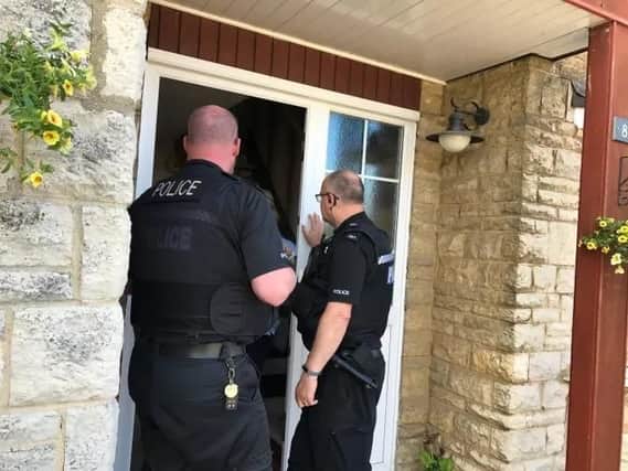 Police officers visit residents to provide anti-burglary advice as part of Operation Jockey. Photo: Thames Valley Police