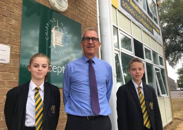 Chipping Norton School head teacher Simon Duffy with two pupils during his last week in charge NNL-180719-151951001