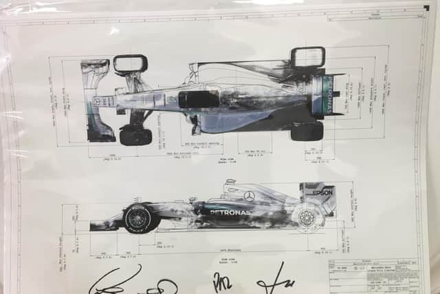 The diagram of a Mercedes F1 car signed by Lewis Hamilton, Nico Rosberg, Paddy Lowe and Toto Wolff