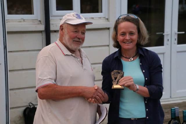 Mara Yamauchi receives her medal from Peter Hart. Photo: Barry Cornelius