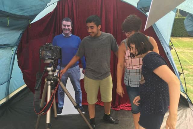 The card board cut out photo booth proved a big hit at Sean-stock NNL-180724-101929001