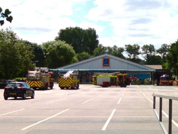 A reader's photo of fire engines at Aldi after a fire caused the store to be evacuated