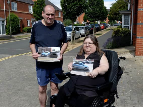 Mike and Kerry Wall have problems with motorists parking illegally near their Alma Road home, with pictures of the culprits
