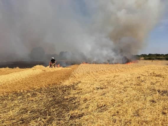 Firefighters tackling a fire on a farm in Ardley on August 6, at 1.40pm.