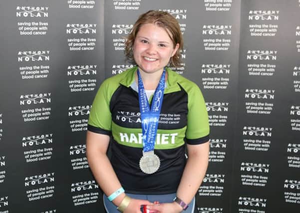 Harriet Berry with her medal after finishing Ride London 100 NNL-180814-113755001
