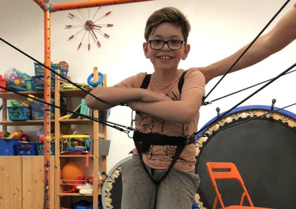 Ronnie Jacob, 11, who is undergoing  intensive physio to stay mobile