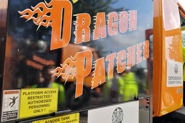 The Dragon Patcher uses a combination of compressed air, heat, bitumen and chippings to repair holes. Photo: Oxfordshire County Council