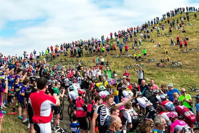 A huge crowd gathered at Burton Dassett Hills to see the Tour of Britain riders. Photo: Simon Wilkinson