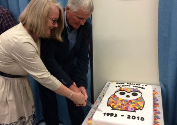 Former head teacher Andrew Bowen and current head Stell Belgrove cut the cake