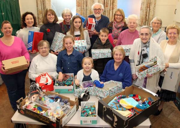 Volunteers at Middleton Cheney Methodist Church wrapping and filling shoeboxes for needy children all over the world as part of Operation Christmas Child last year
