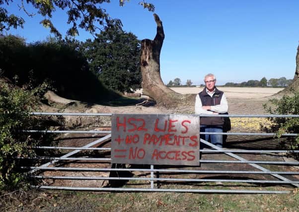 Farmer Simon Burton laid a huge fallen tree in front of his field near Wormleighton in protest at his treatment by HS2. Photo: Simon Burton NNL-180926-111323001