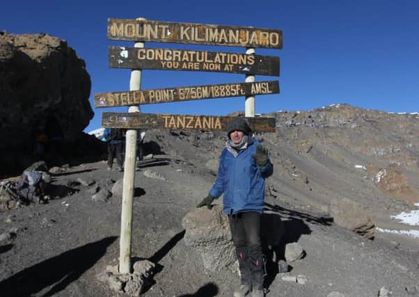 Richard Valdambrini reaches the summit of Mt Kilimanjaro. He is raising money for The David Sheldrick Wildlife Trust who rehabilitate orphaned elephants NNL-180110-120101001