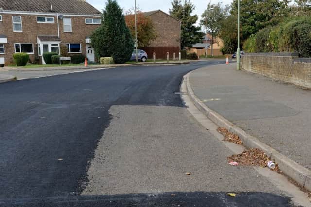 While a car-shaped hole was left in the new tarmac on Bretch Hill. NNL-180210-154216009