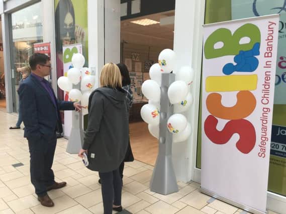 Neil Blackwell chats to parents outside the SCIB pop-up shop