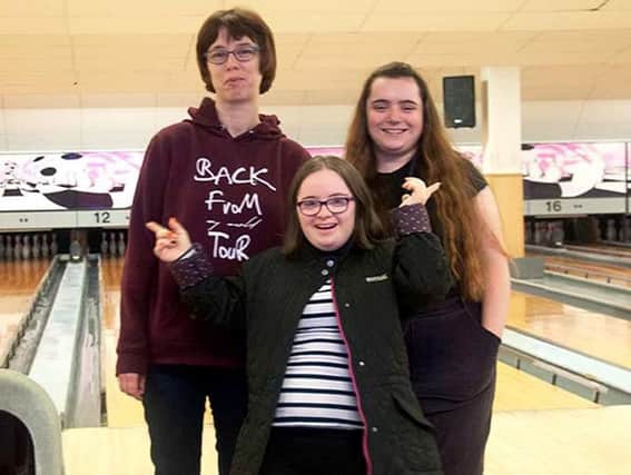 Some of the people Dashwood supports having fun at the bowling alley. Photo: Advance