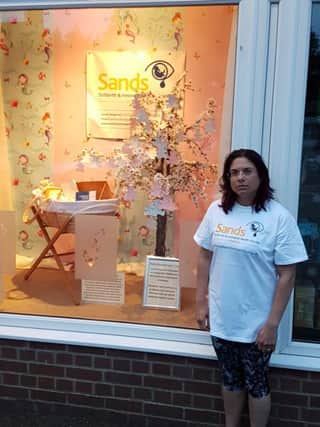 Oxfordshire Sands Karon Hancox next to Edd Frost and Daughters window display NNL-181106-133415001