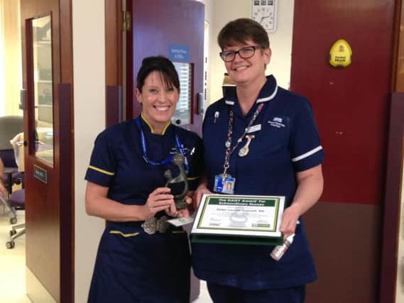 Ward sister Louise Garrett is presented with her DAISY award by chief nurse Sam Foster. Photo: OUH NHS Foundation Trust