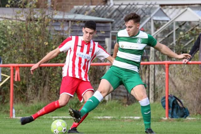Easington Sports striker George Coombes takes on Wantage Town's Dan Comer during Saturday's Bluefin Sports Challenge Cup tie